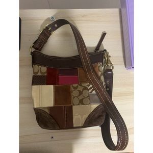 Brand: Coach, Color: Brown, patterned crossbody purse. Lightly used.
